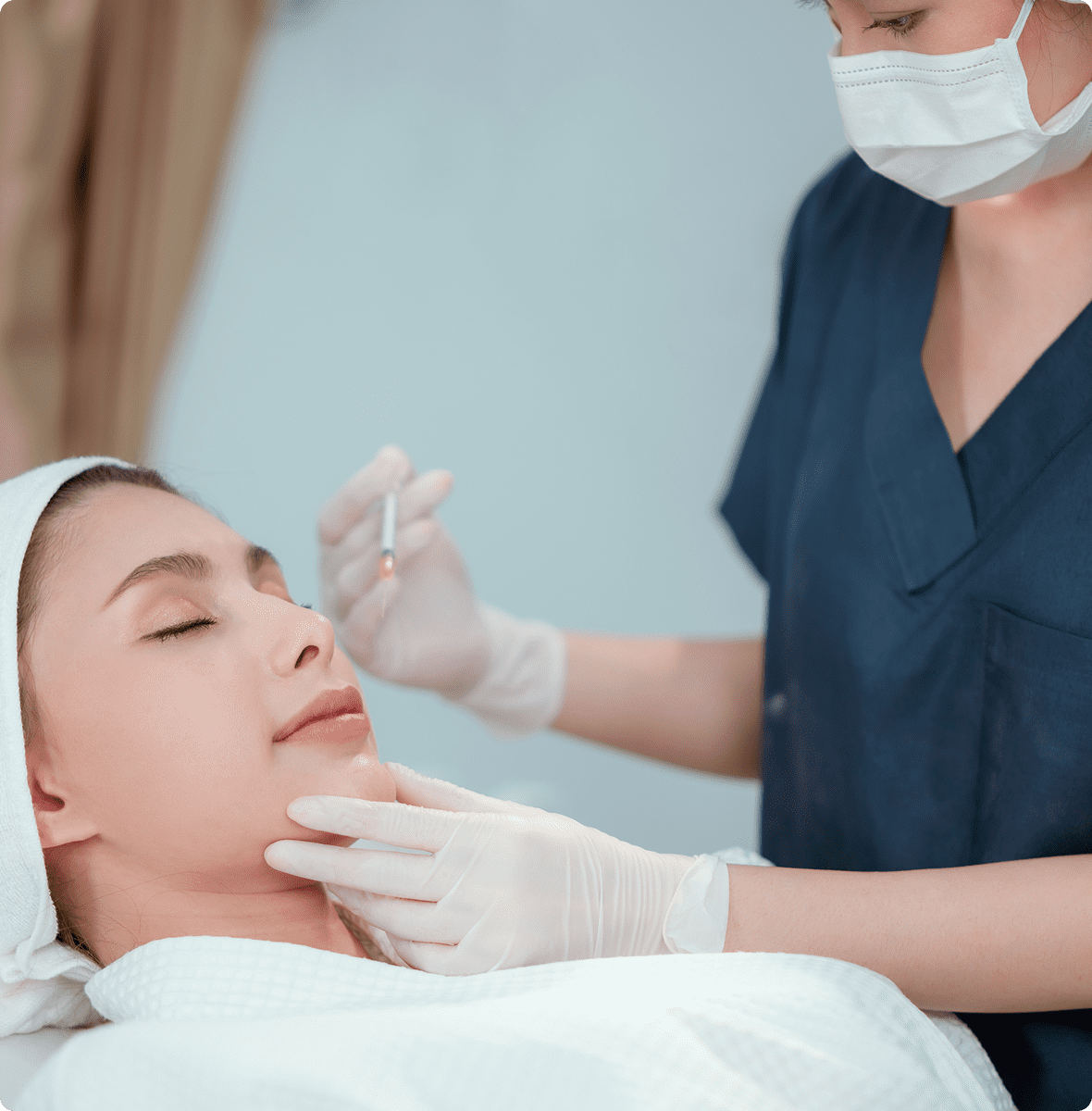 Aesthetician performing cosmetic procedure