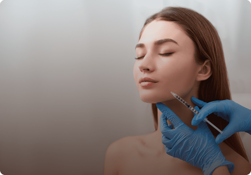 Facial treatment with syringe