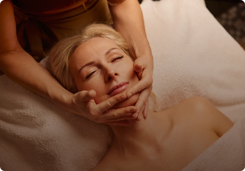 Woman receiving a relaxing facial massage